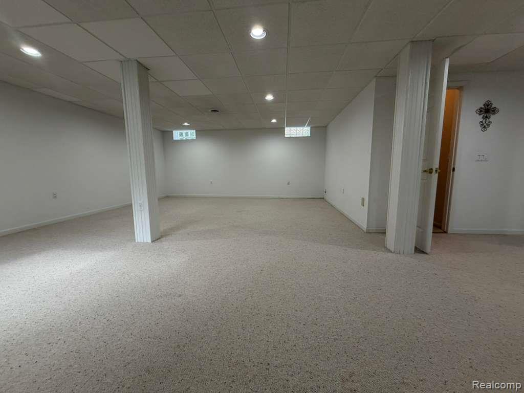 1154 Bluebird Drive Rochester, MI 48307 - Photo 29 of 34 Expansive carpeted area featuring recessed lighting, a drop ceiling, and white painted walls