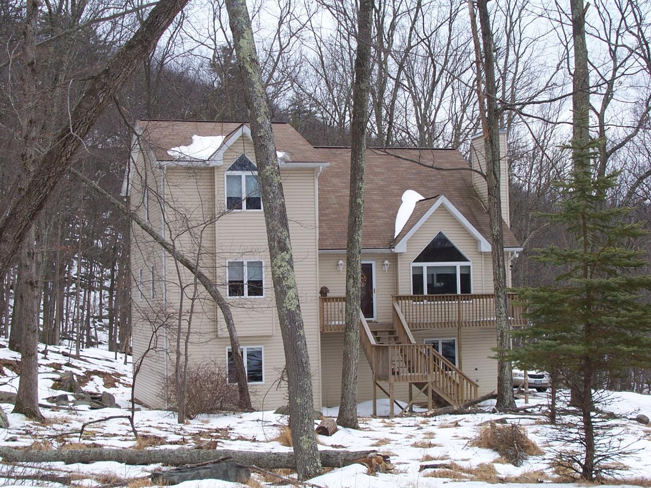 2725 Radcliff Road Bushkill, PA 18324 - Photo 1 of 9 a front view of a house with a yard