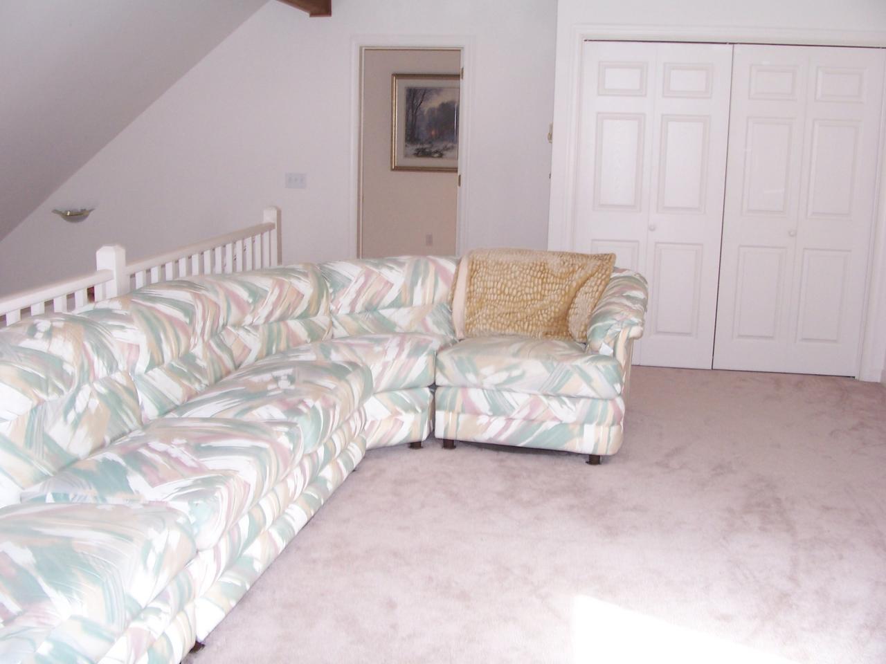 2725 Radcliff Road Bushkill, PA 18324 - Photo 7 of 9 a living room with a bed