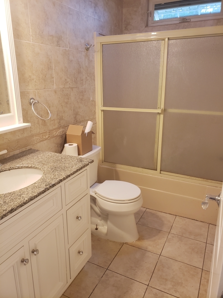34 Katie Lane Waterbury, CT 06708 - Photo 14 of 15 a bathroom with a granite countertop toilet a sink and a mirror