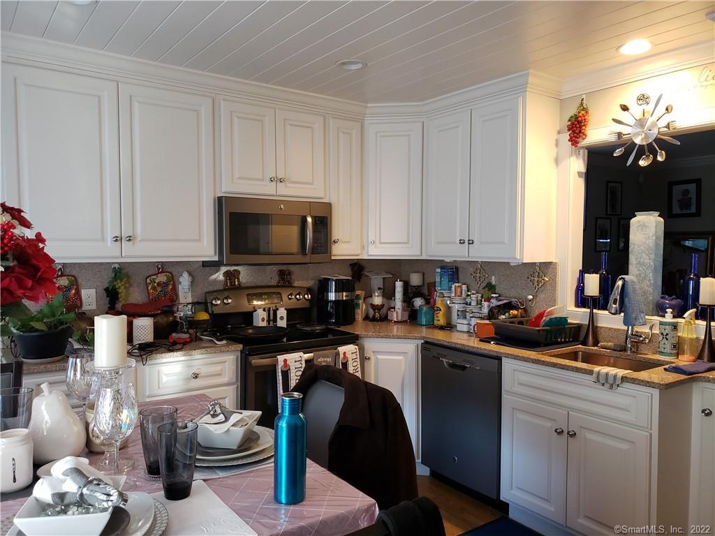 34 Katie Lane Waterbury, CT 06708 - Photo 7 of 15 a kitchen with a sink cabinets and appliances