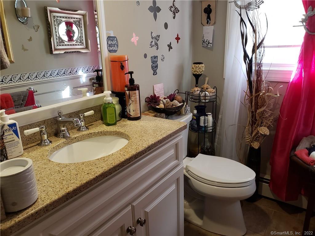 34 Katie Lane Waterbury, CT 06708 - Photo 8 of 15 a bathroom with a granite countertop toilet sink and mirror