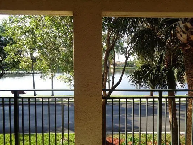 a view of a palm tree from a balcony