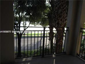 2442 Centergate Drive, Unit 205 Miramar, FL 33025 - Photo 12 of 40 a view of porch with a tree