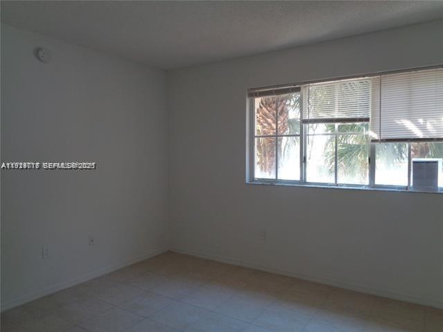 2442 Centergate Drive, Unit 205 Miramar, FL 33025 - Photo 16 of 40 an empty room with a window