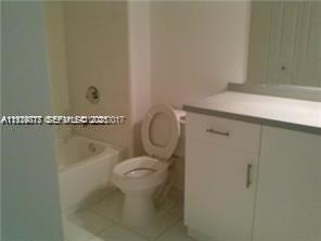2442 Centergate Drive, Unit 205 Miramar, FL 33025 - Photo 19 of 40 a close view of a sink and a toilet in a bathroom