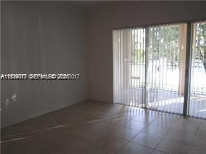 2442 Centergate Drive, Unit 205 Miramar, FL 33025 - Photo 27 of 40 a view of a livingroom with an empty space and a window