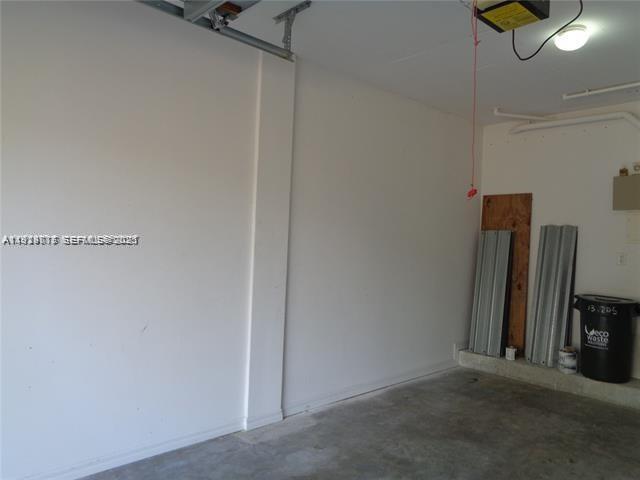 2442 Centergate Drive, Unit 205 Miramar, FL 33025 - Photo 34 of 40 a view of a room with wooden floor