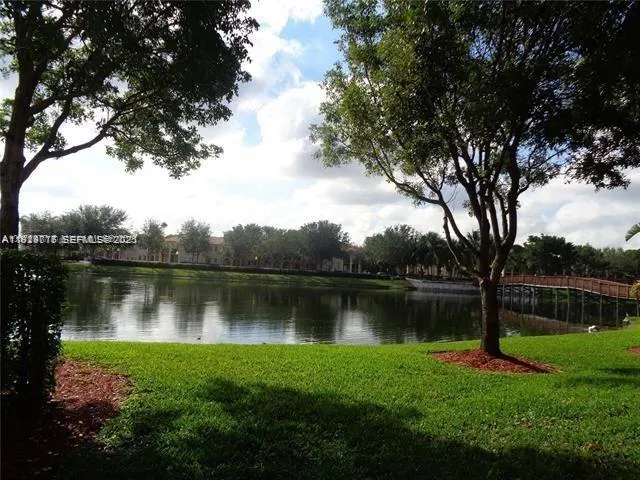 a view of a lake in a forest