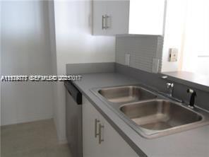 2442 Centergate Drive, Unit 205 Miramar, FL 33025 - Photo 4 of 40 a close view of sink and tap