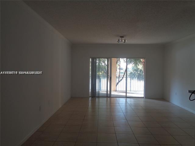 2442 Centergate Drive, Unit 205 Miramar, FL 33025 - Photo 8 of 40 a view of an empty room with a window