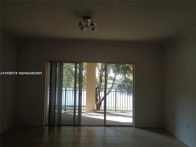 2442 Centergate Drive, Unit 205 Miramar, FL 33025 - Photo 9 of 40 a view of an empty room and window