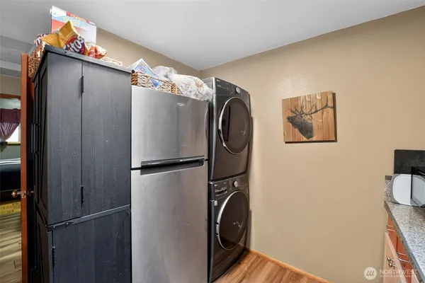 a metallic refrigerator freezer sitting in a kitchen