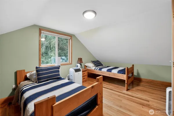 a bedroom with furniture and window