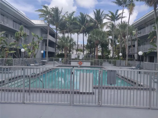 a balcony with trees in front of it