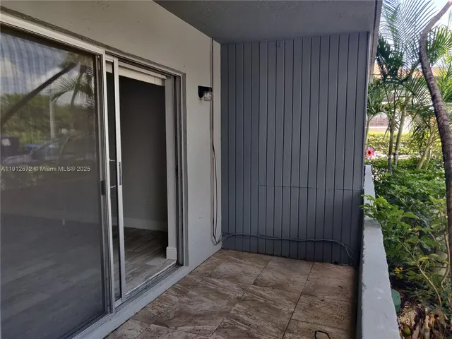 a kitchen with stainless steel appliances granite countertop a sink and a microwave
