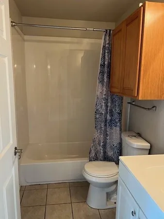 a bathroom with a toilet a sink and bathtub