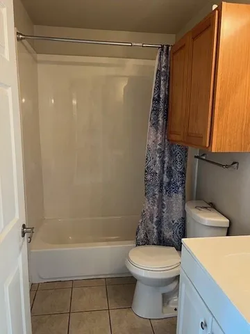 a bathroom with a toilet a sink and bathtub