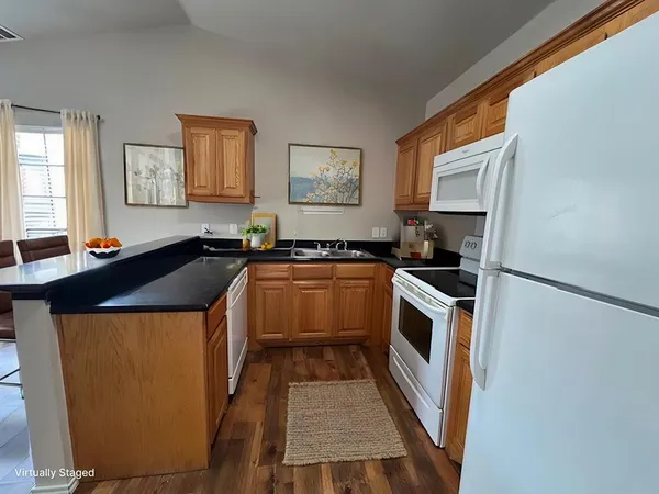 a kitchen with a sink stove and microwave