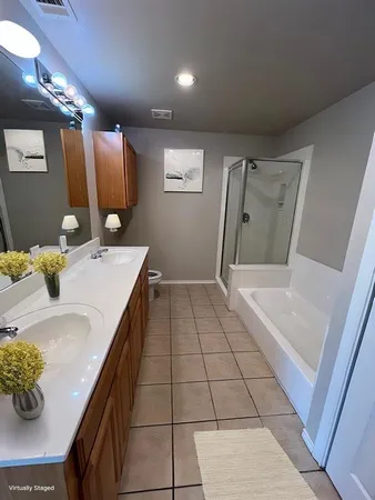 a bathroom with a sink mirror and vanity