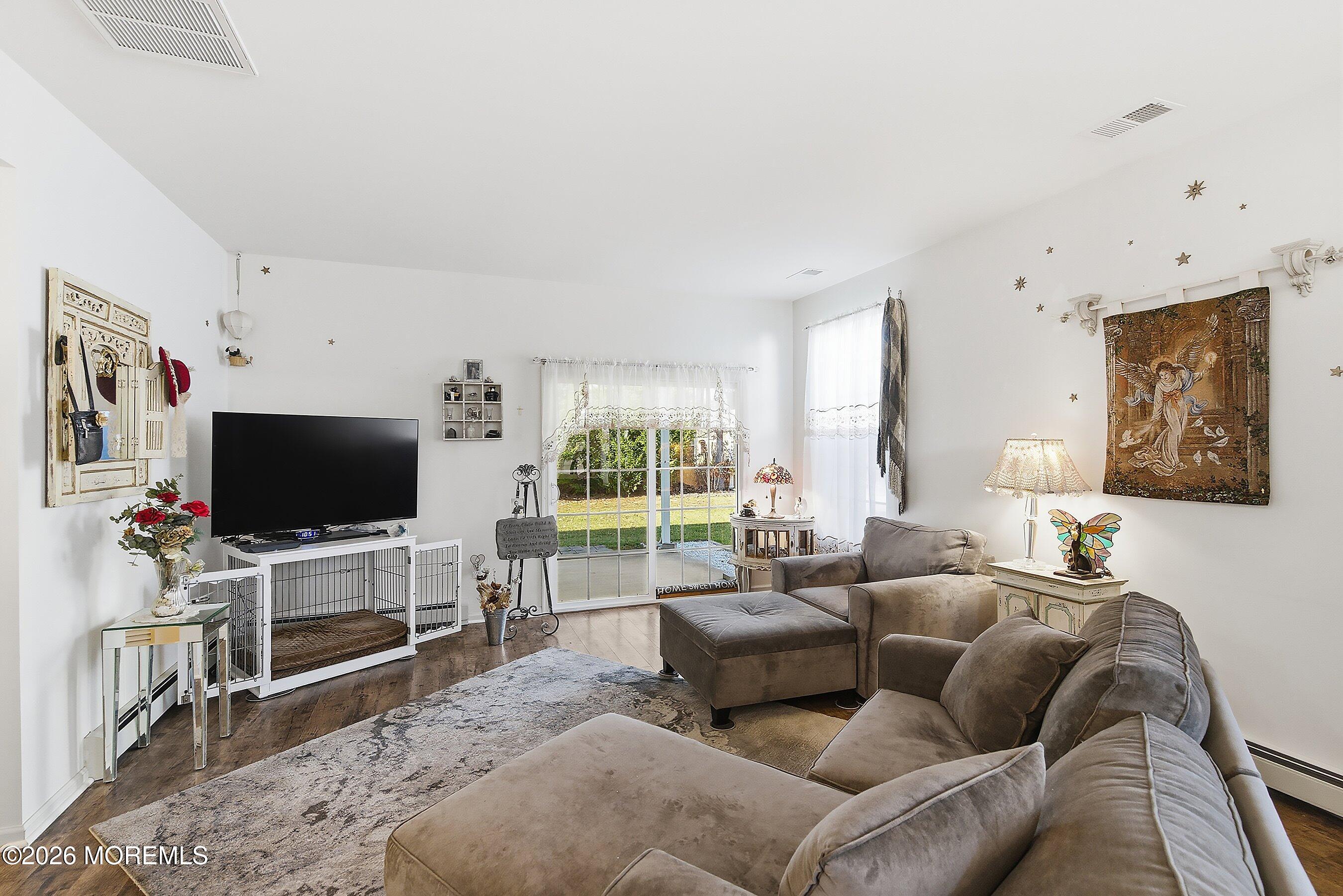 46 Hatteras Way Barnegat, NJ 08005 - Photo 5 of 27 a living room with furniture and a flat screen tv
