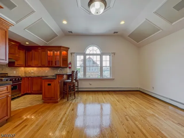 a view of kitchen with window and wooden floor