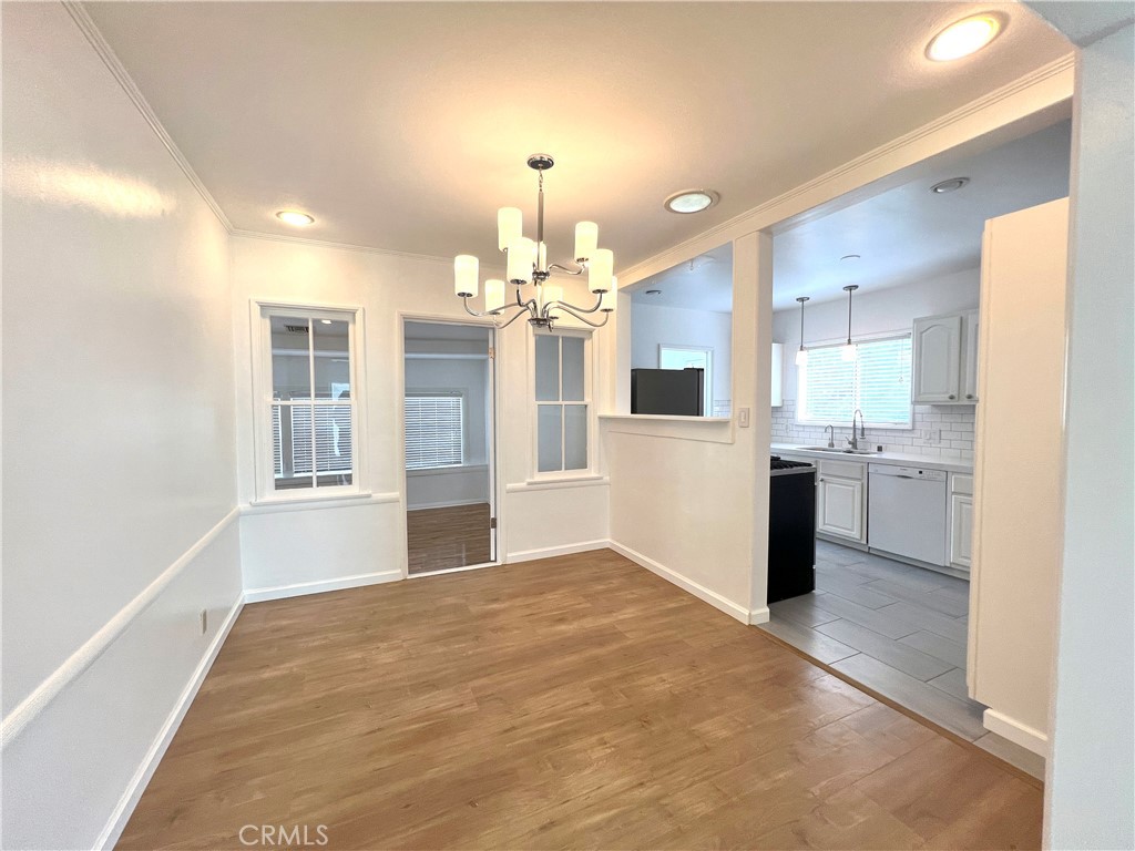 10347 Weddington Street North Hollywood, CA 91601 - Photo 3 of 15 a view of a kitchen with a sink and cabinet area