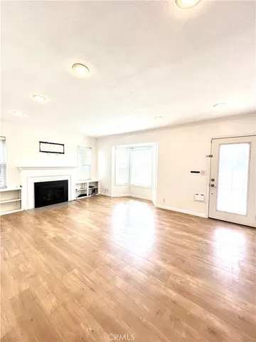 a view of empty room with a fireplace