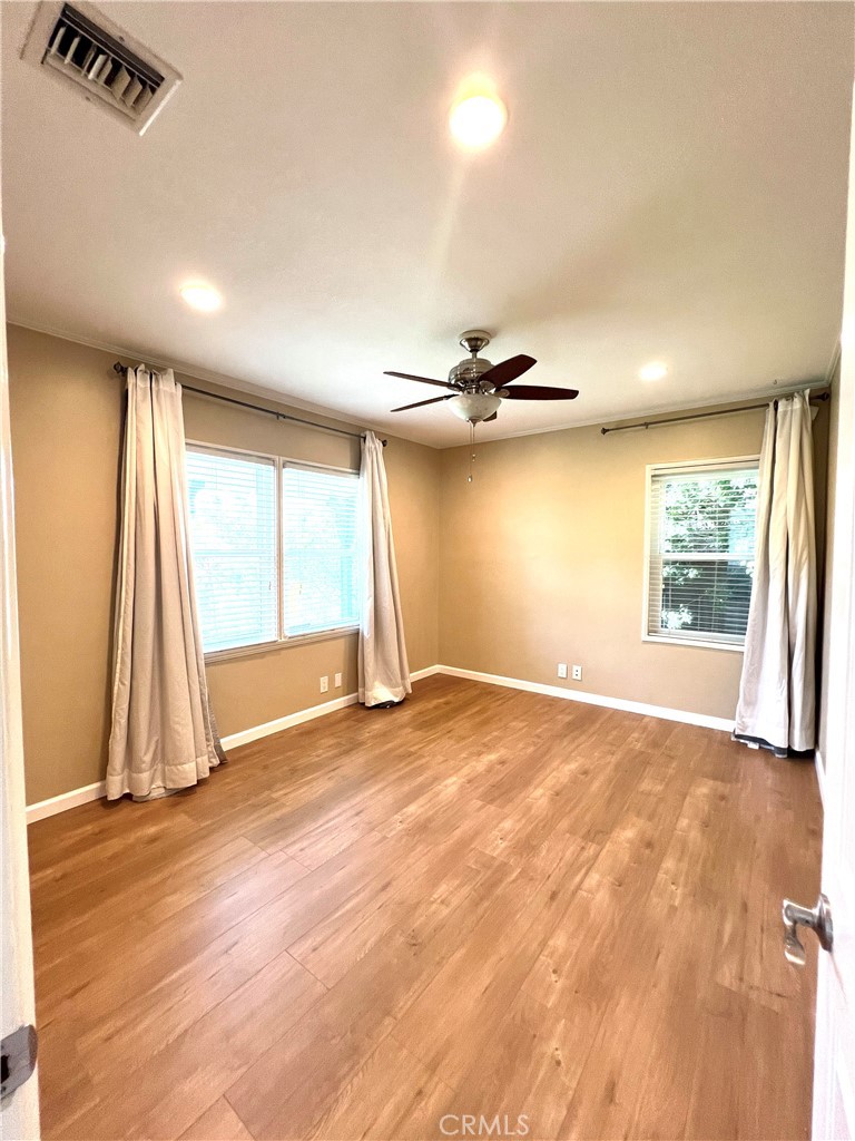 10347 Weddington Street North Hollywood, CA 91601 - Photo 5 of 15 an empty room with wooden floor and windows