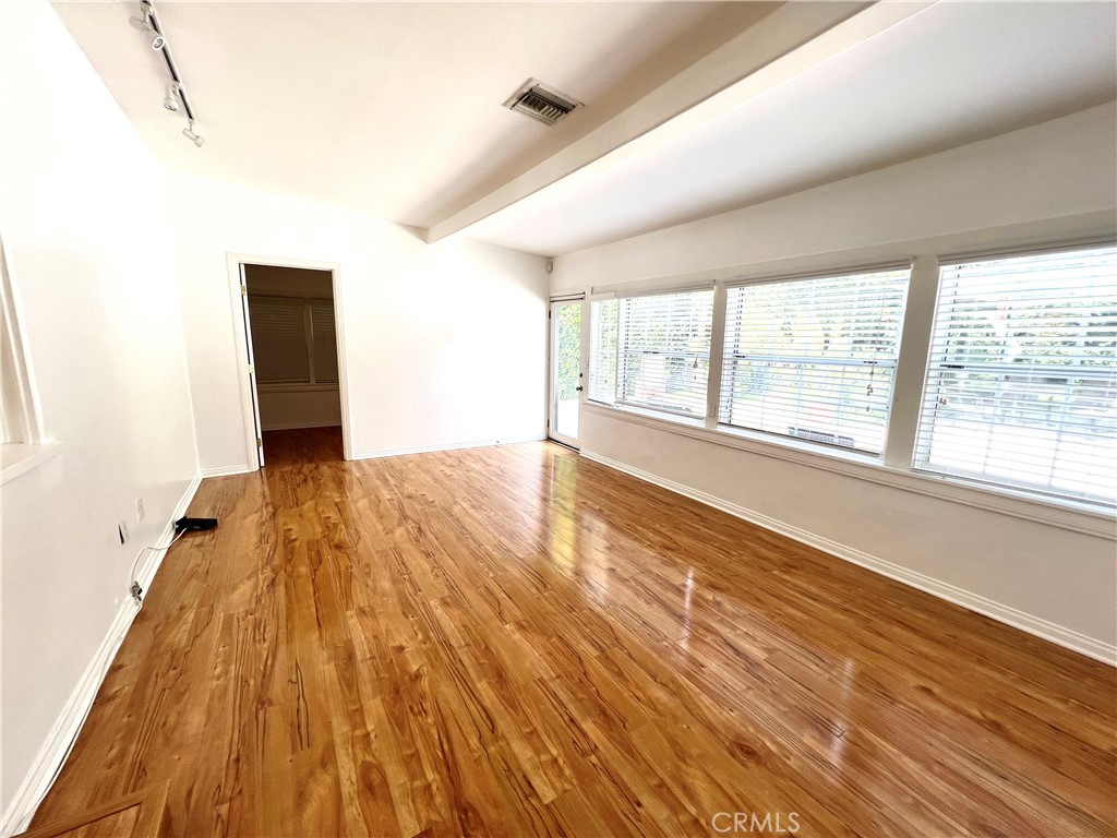 10347 Weddington Street North Hollywood, CA 91601 - Photo 7 of 15 a view of an empty room with wooden floor and a window