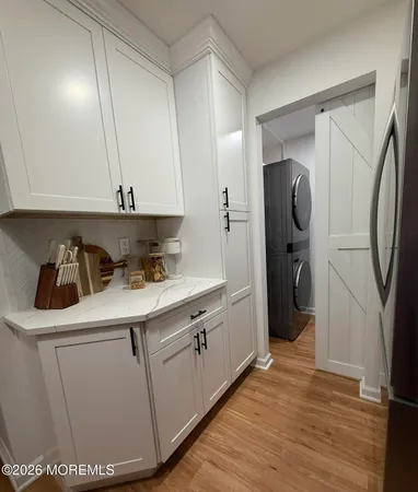 a view of a sink and washer dryer