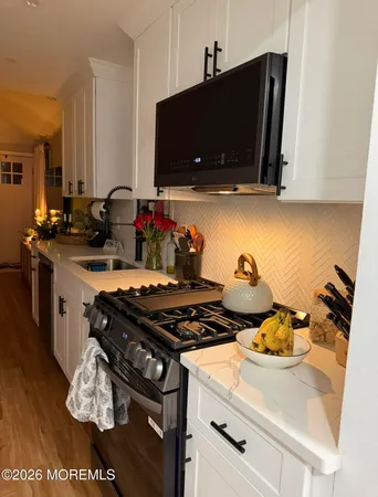 a kitchen with a stove and a microwave