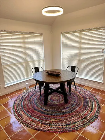 a living room with a table and a table