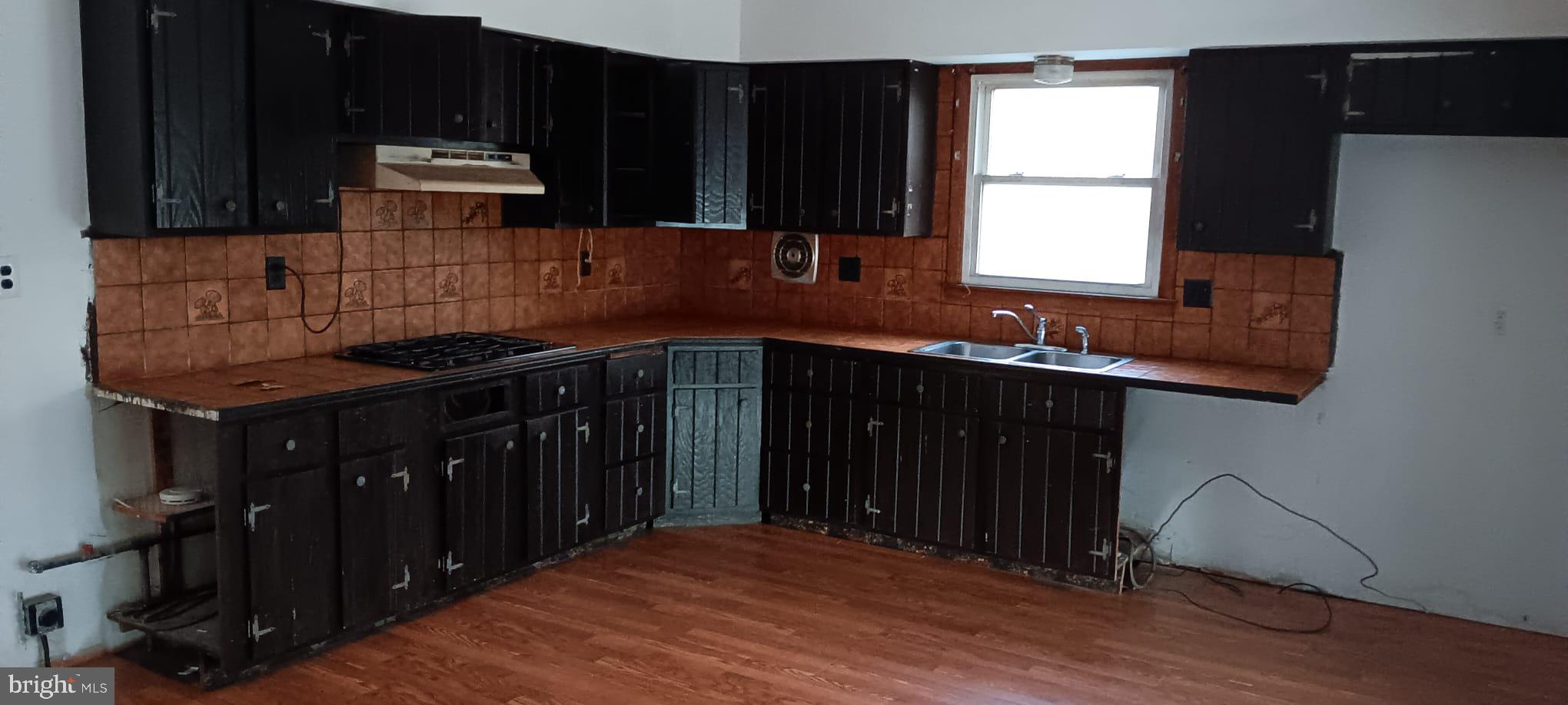 619 Laurel Road Lindenwold, NJ 08021 - Photo 13 of 17 a kitchen with sink a window and cabinets