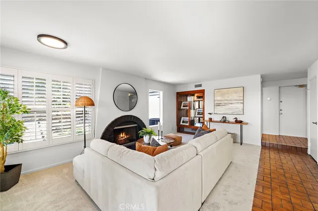 a kitchen with a sink a stove and chairs