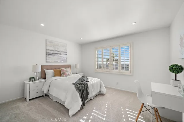 a view of a porch with furniture and a potted plant