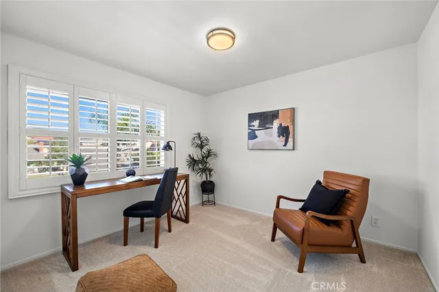 a view of a porch with furniture and a potted plant