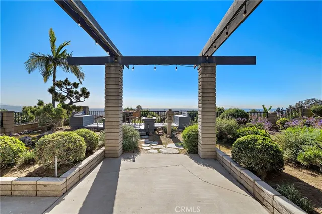 a view of a patio with furniture and a potted plant