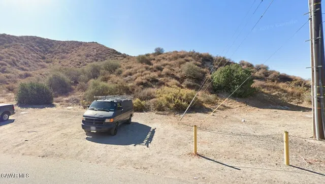 a view of roof with mountain view