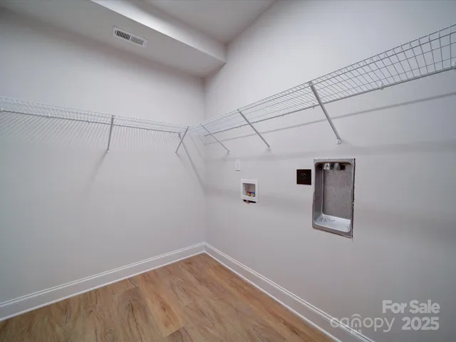 a view of a room with racks on the wall