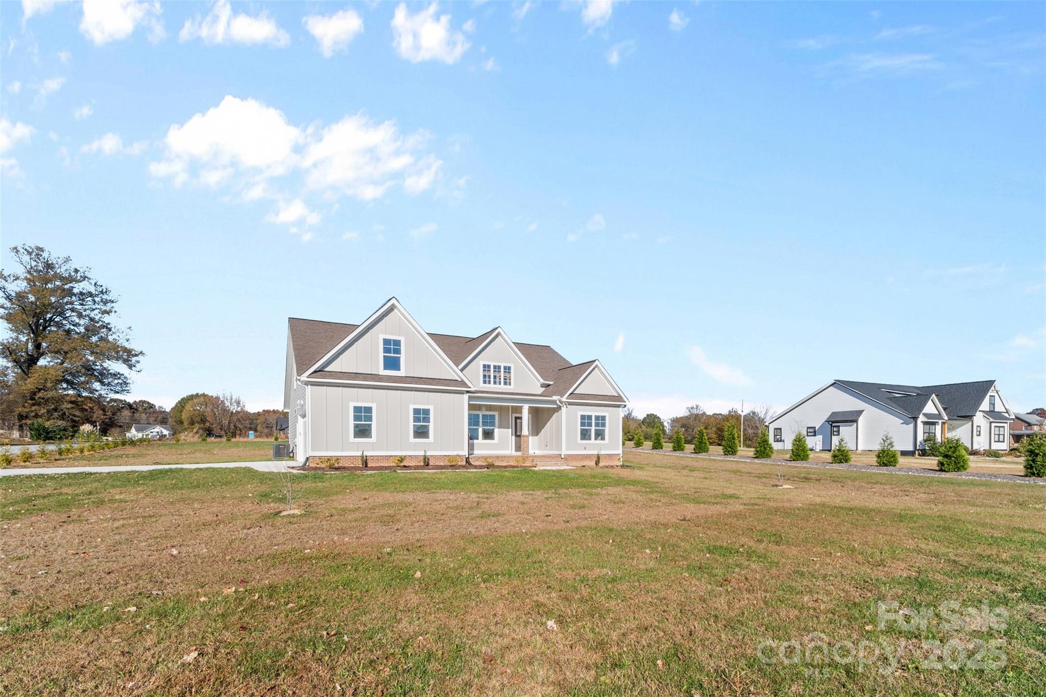 220 Lawyers Road Monroe, NC 28110 - Photo 2 of 36 a front view of a house with a yard