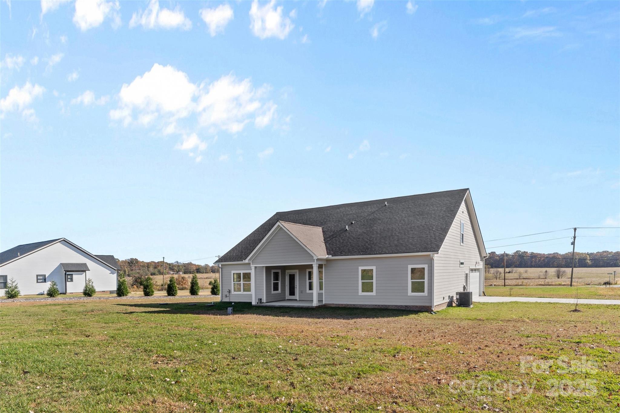 220 Lawyers Road Monroe, NC 28110 - Photo 4 of 36 a front view of a house with a yard