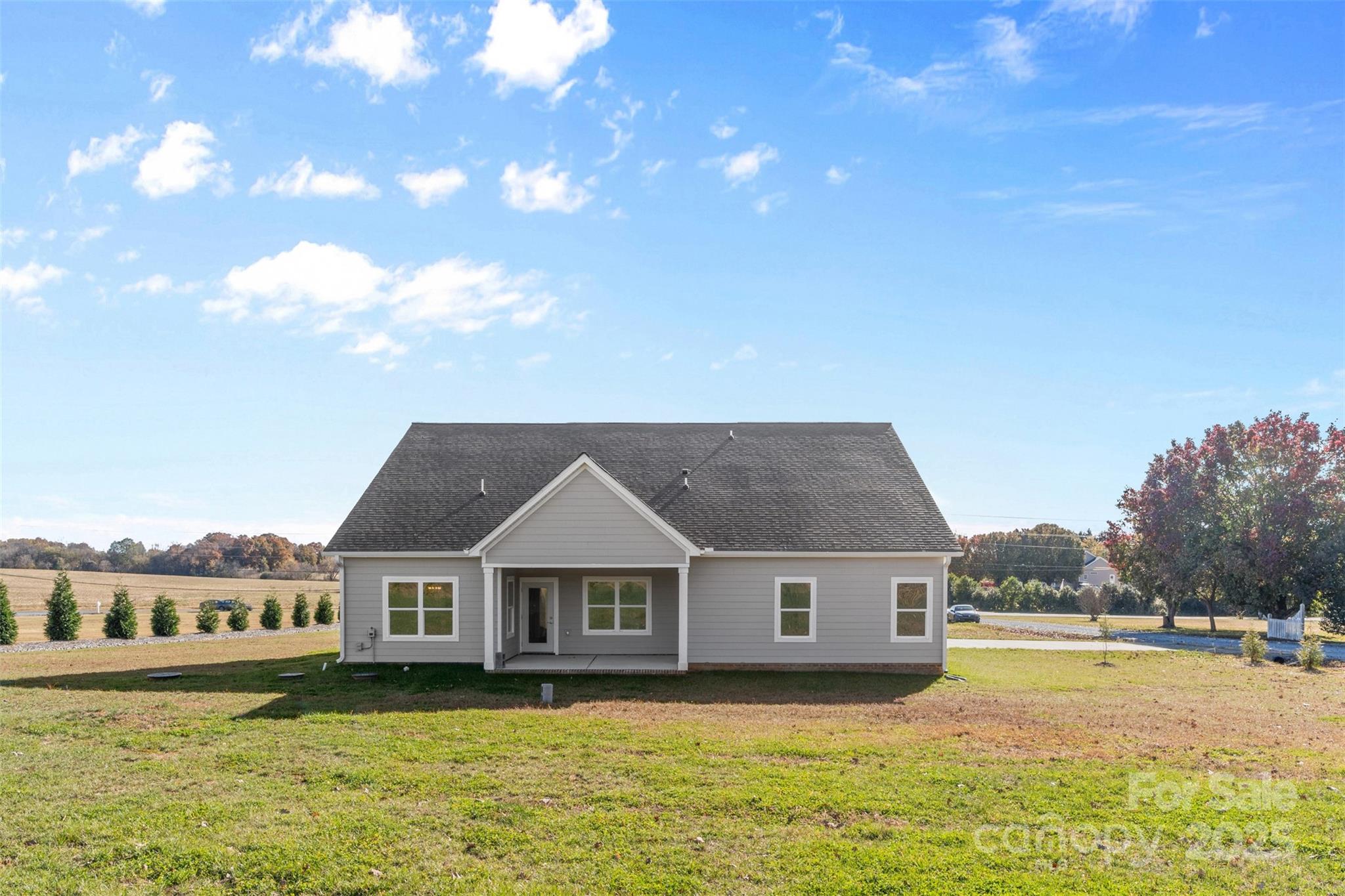 220 Lawyers Road Monroe, NC 28110 - Photo 5 of 36 a front view of house with yard and lake view