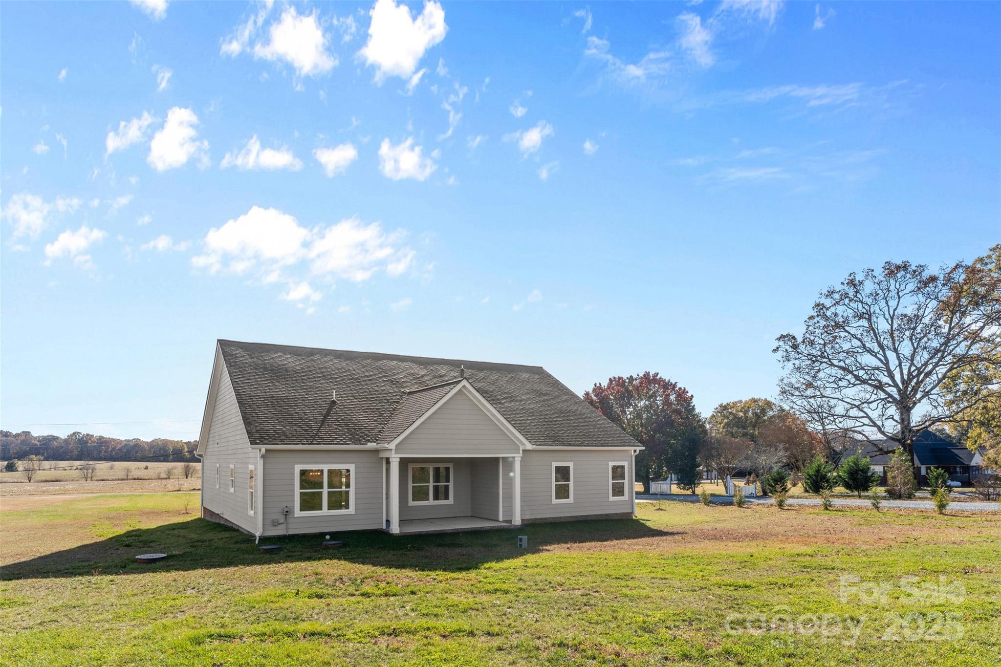 220 Lawyers Road Monroe, NC 28110 - Photo 6 of 36 a front view of house with yard and lake view