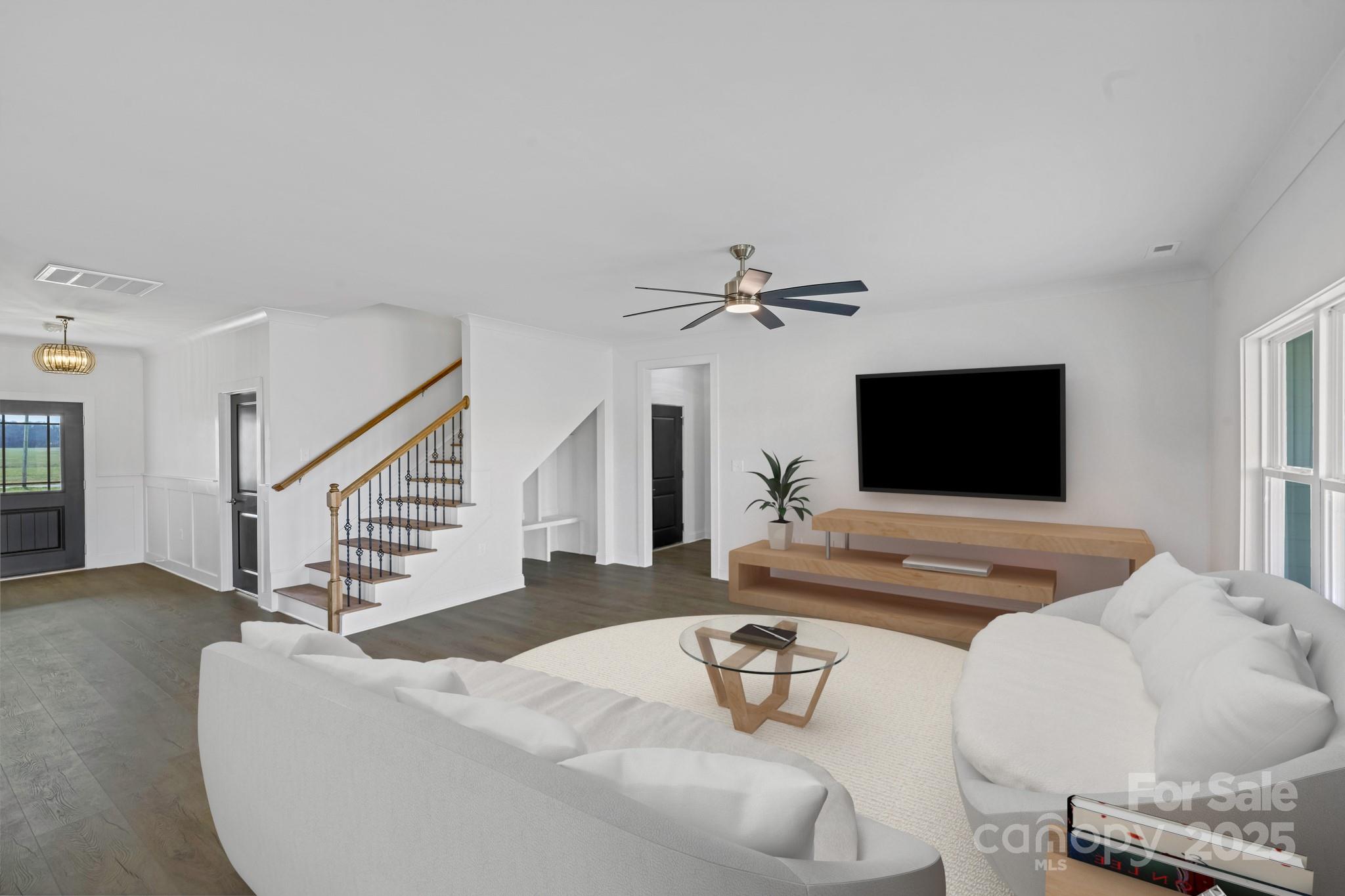 220 Lawyers Road Monroe, NC 28110 - Photo 7 of 36 a living room with furniture and a flat screen tv