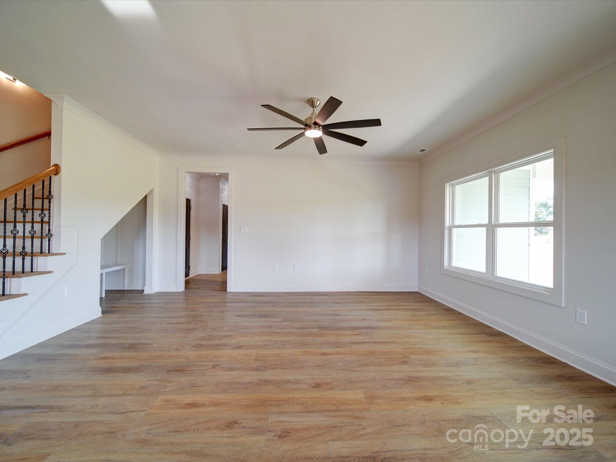220 Lawyers Road Monroe, NC 28110 - Photo 9 of 36 wooden floor in an empty room with a window