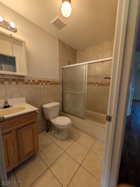 73 Fulton Street Elizabeth Port, NJ 07206 - Photo 19 of 23 a bathroom with a toilet a sink and shower