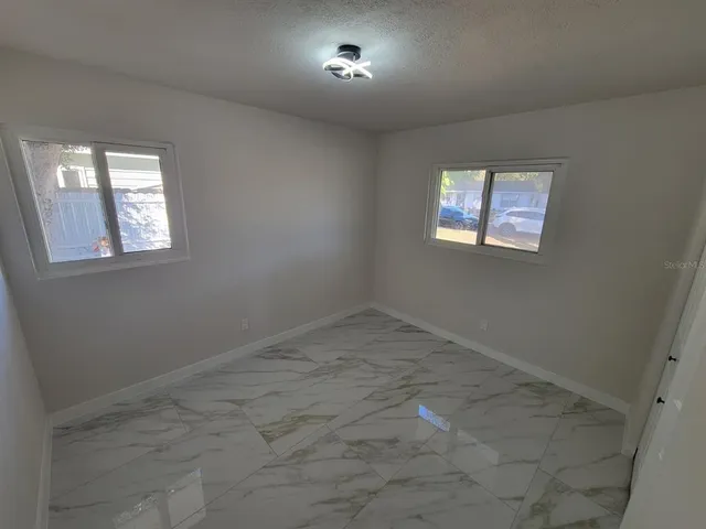 an empty room with windows