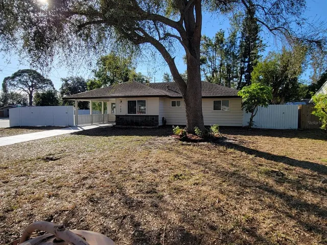 a house with trees in the background