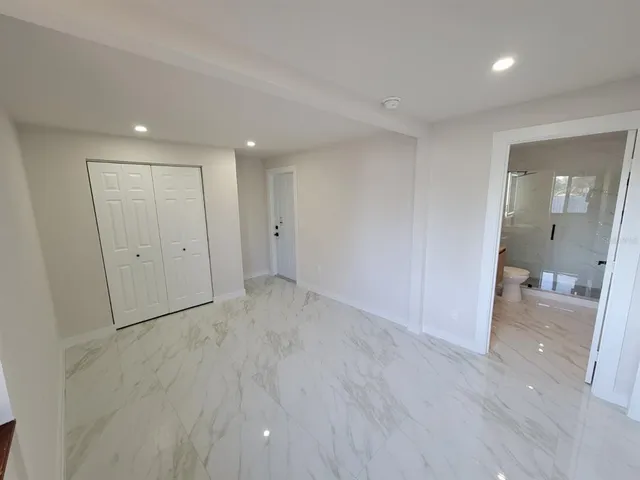 a view of a livingroom with wooden floor
